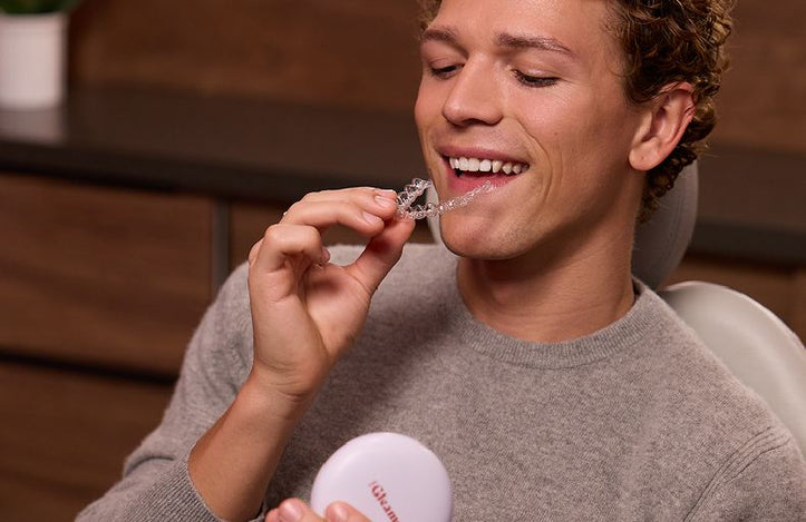 Man inserting dental aligners