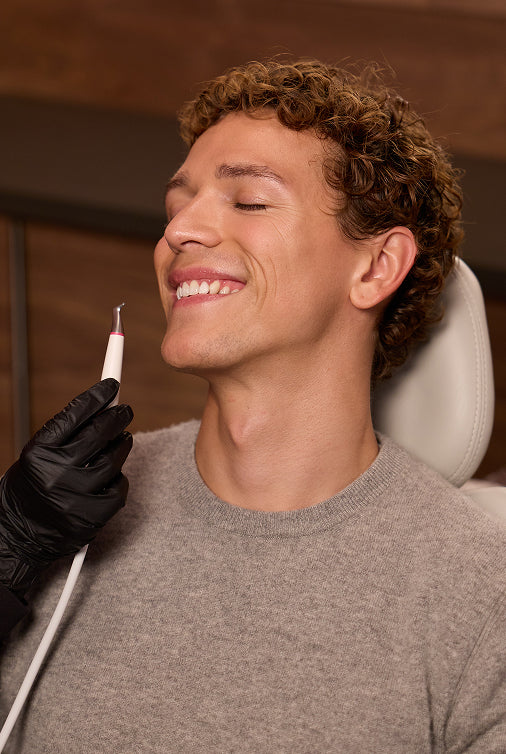 Smiling person about to receive dental treatment